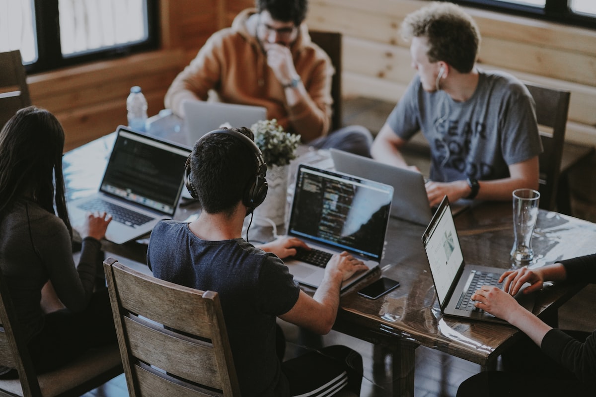 Marketing team collaborating around a campaign brief in a modern office